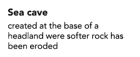 Sea cave created at the base of a headland were softer rock has been eroded